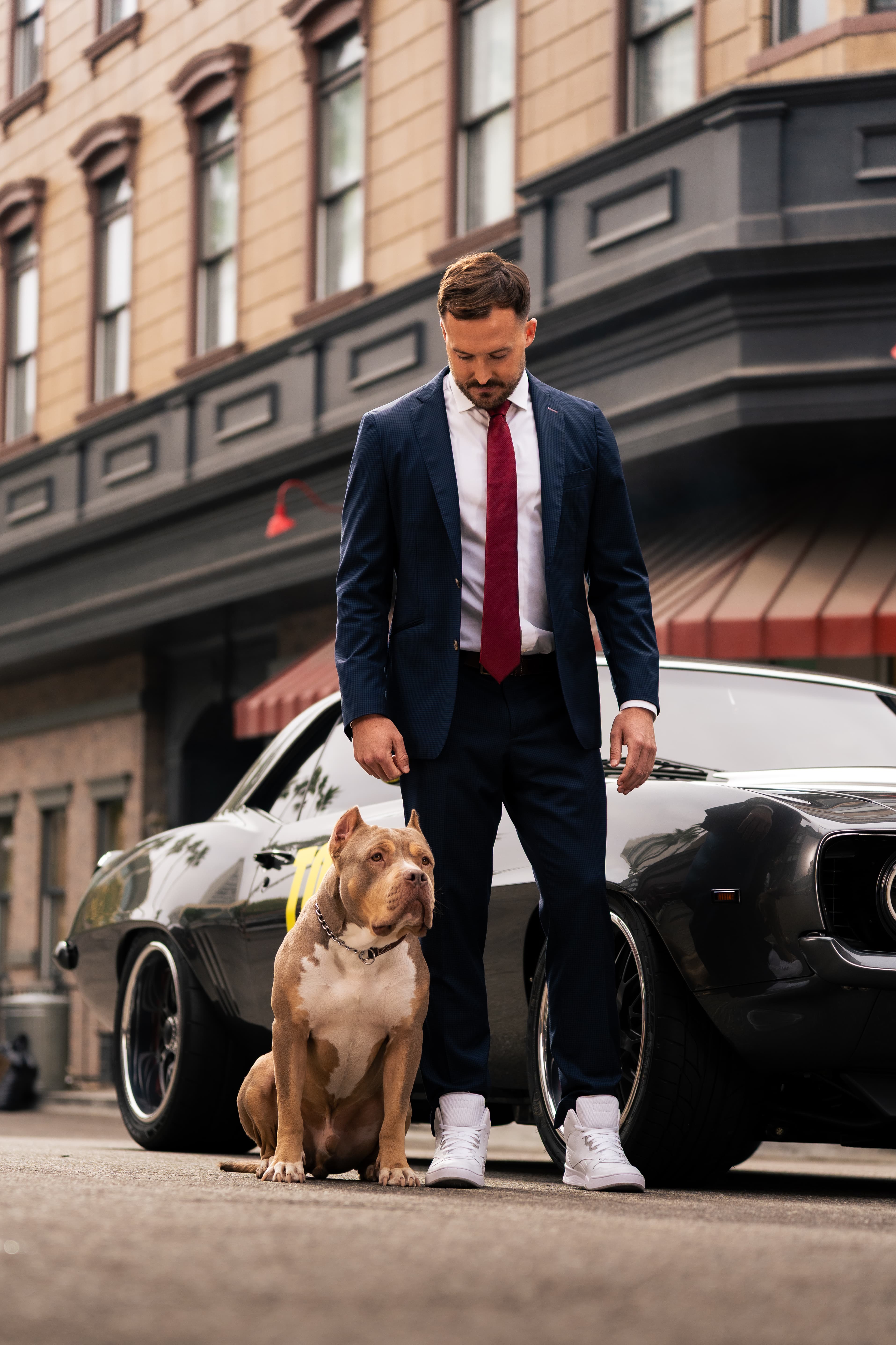 A TopDog Law team member standing with a dog